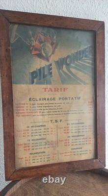 Ancienne affiche publicitaire Pile Wonder Tarif éclairage TSF encadrée